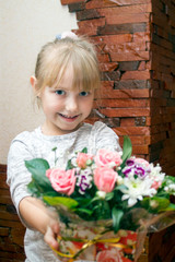 Fototapeta na wymiar girl with a bouquet of flowers. girl child gives flowers congratulations on the holiday