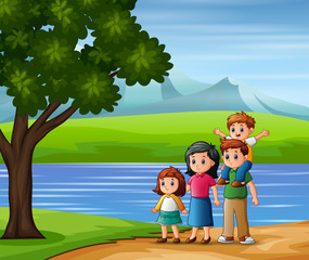 Obraz na płótnie Canvas Happy family outdoors enjoying the nature view