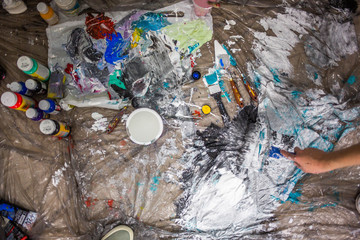 Decorator's hand painting wall with roller