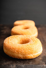 Donut with apple jam on the rustic background. Selective focus.
