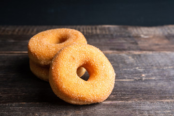 Donut with apple jam on the rustic background. Selective focus.