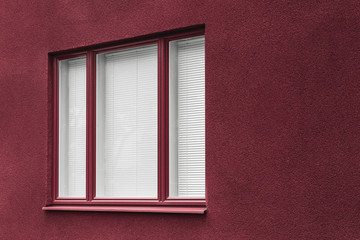 Fototapeta premium Window of a cherry red building