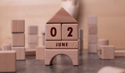 June 2 written with wooden blocks