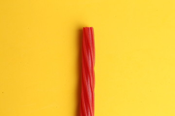 sweet red gummy licorice in color background
