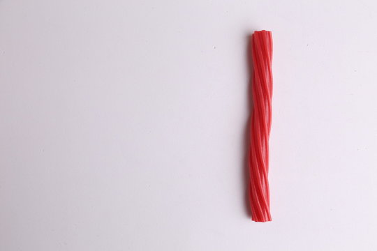 sweet red gummy licorice in color background