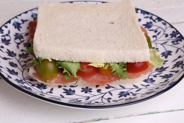 Spanish serrano ham sandwich with tomato and lettuce