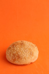 delicious bread rolls on colored background