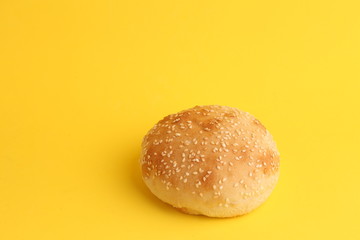 delicious bread rolls on colored background