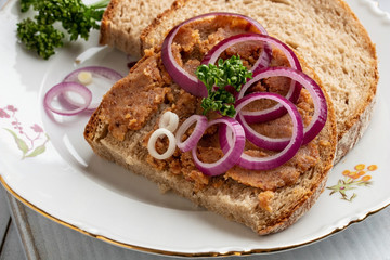 Pork lard mixed with ground cracklings on a slice of bread
