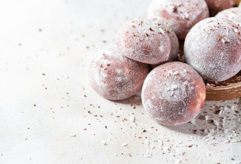 Chocolate coconut Japanese ice cream Mochi in rice dough. Traditional Japanese dessert on white background.