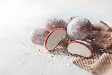 Chocolate coconut Japanese ice cream Mochi in rice dough. Traditional Japanese dessert on white background.