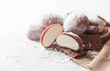 Chocolate coconut Japanese ice cream Mochi in rice dough. Traditional Japanese dessert on white background.