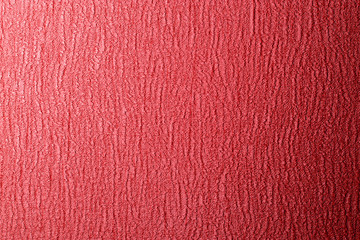 Brightly red background with texture.