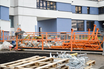 Large iron metal building facade elevator cradle for lifting workers and a load of building...