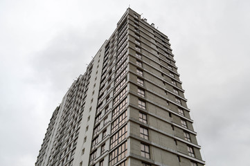 Large concrete cement modern under construction new modern monolithic frame-block house building...
