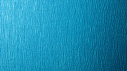 Bright blue background with texture.