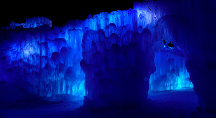 Stunning view of a chamber inside a blue grotto full of natural ice formations.