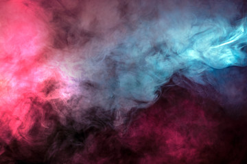 Obraz na płótnie Canvas Abstract texture of backlit smoke in red blue on a black background.