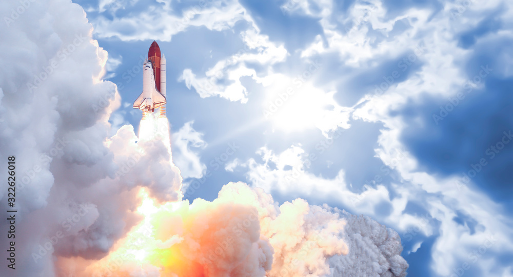 Wall mural the spaceship rocket shuttle in the cloudy sky fly up high to the space elements of this image furni