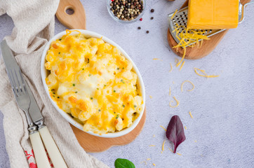 Mac and cheese. Traditional baked macaroni with cheese in baking form. American cuisine. Horizontal...