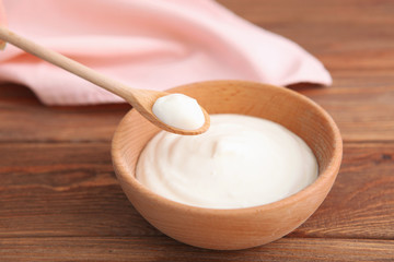 Fototapeta na wymiar Natural white yogurt on the table. Healthy snack, Greek yogurt.