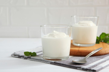 Natural white yogurt on the table. Healthy snack, Greek yogurt.