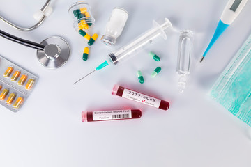 Blood test tube with the Coronavirus disease for virus test and research