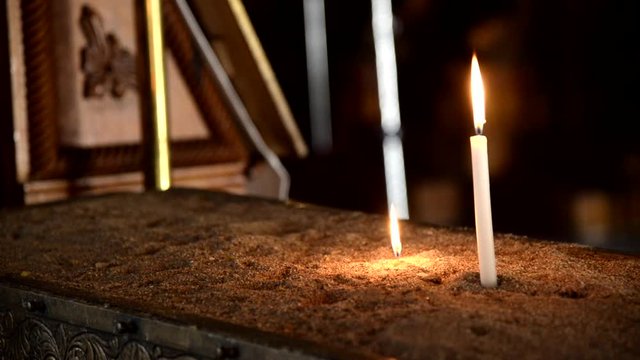 Two candles with flames in a Church at Chios Island Geece.