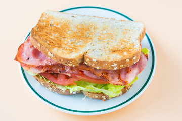 A BLT is a type of sandwich, named for the initials of its primary ingredients, bacon, lettuce and...