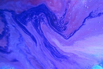 Purple-blue marble abstract background. Natural stone texture. Acrylic paint flows freely and...