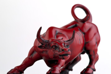 Figurine of a red bull isolated on white