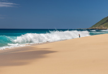 Large waves crash on the shoreline of Keawaula beach on the extreme west coast of Oahu in Hawaii