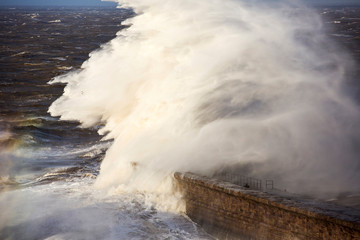 Storm waves from an extreme low pressure system batter Whitehaven harbour, Cumbria, UK, on the 10th December 2014.