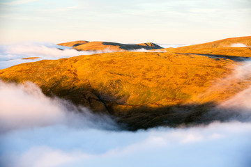 Looking towards High Street from Red Screes in the Lake District, Cumbria, UK, with valley cloud caused by a temperature inversion.