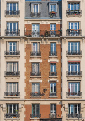 Fototapeta na wymiar Paris, France - 04 14 2019: Building facade along the Canal de L'Ourcq