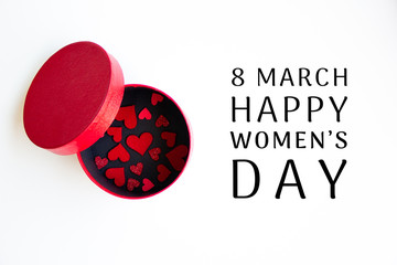 red hearts in a round red inside black box and Happy 8 March International Women's Day lettering