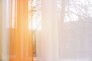 Fototapeta na wymiar curtain window with sunlight in early morning
