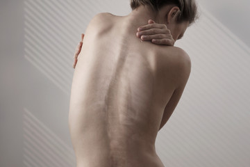 Woman with back pain, Scoliosis spine curve. Female body aesthetic,healthcare concept