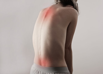 Woman with back and neck pain, spine curve. Female body aesthetic