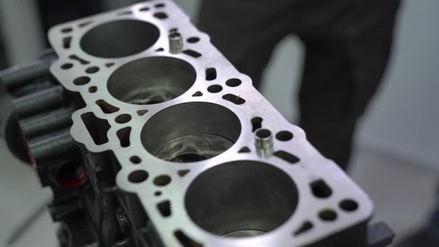 Open engine part spare car crankcase at service station repair tools internal vehicle motor camera movement