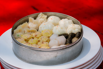 Dim sum in bamboo steamer, chinese cuisine. Dim sum in steam chinese cuisine hong kong. yumcha,The Arrangment of various dim sum in bamboo steamer with chinese bun