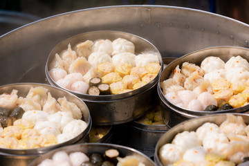 Dim sum in bamboo steamer, chinese cuisine. Dim sum in steam chinese cuisine hong kong. yumcha,The Arrangment of various dim sum in bamboo steamer with chinese bun