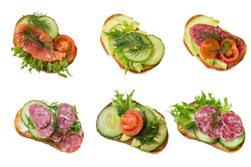 Set  sandwiches with sausage, cucumber, tomatoes, salmon, avocado.