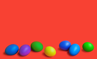 colorful easter eggs on red background. copy space