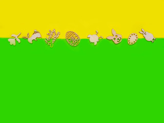 Easter wooden decoration frame against a yellow festive background, copy space