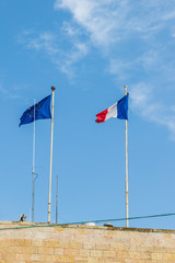 Flags, one of united Europe and second of French