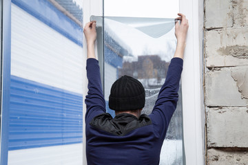 Installation of window film in the office. Protection from ultraviolet radiation.