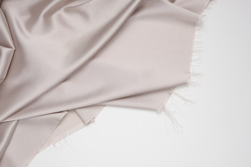 Beige luxurious satin fabric texture for background