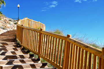 Walkway and wooden fence along sea