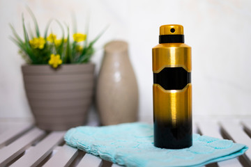 Gold-colored deodorant in the bathroom of a house.